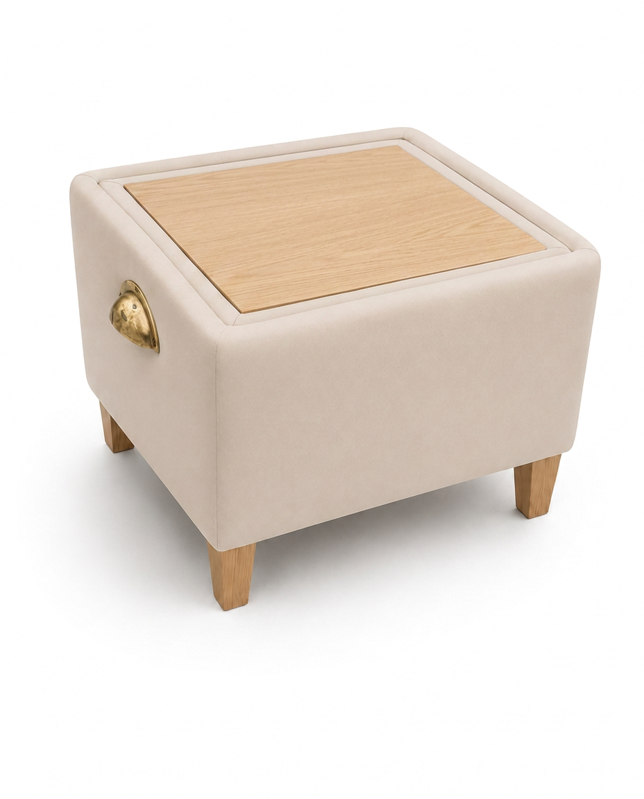 A Pappa Pouffe flipped to its light oak tabletop side with brass handle